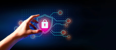 hand of businessman interactive touching a holographic anti-virus security shield system network and...