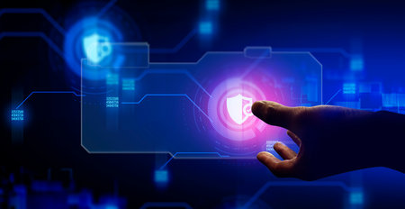 hand of businessman interactive touching a holographic anti-virus security shield system network and...