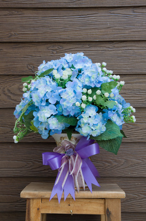 bouquet in vase on wood background,flowers,lover,valentine flowersの写真素材
