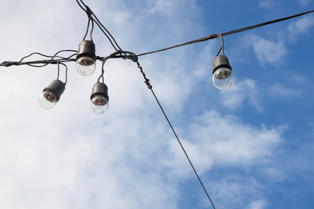 light bulbs on blue sky  backgroundの写真素材