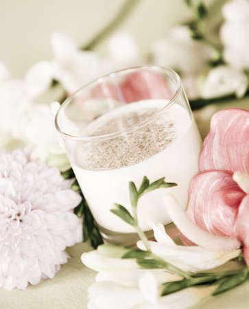 Gourmet dish on decorated table with flowersの写真素材