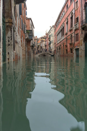Venice, Italy - November 1, 2018: acqua alta, view on a street has been flooded by waters rising 156 cmのeditorial素材