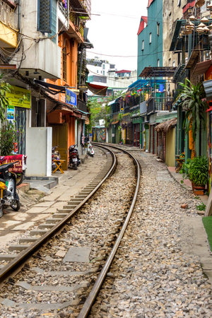 Hanoi, Vietnam, December 30, 2019 : Train Street in Hanoi. Attraction where tourists can watch a train speeding by along a cramped thoroughfare. Street has many shops and cafes.のeditorial素材