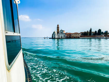 Venice view from a public transport boat vaporetto leaving behind it Veniceの写真素材