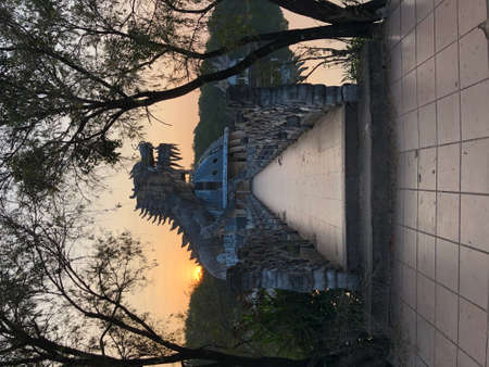 Hue, Vietnam, January 23, 2020, Dragon head in a abandoned Waterpark, Slide and swimming pool left behind, Hue, Vietnamの写真素材