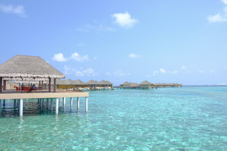 Beautiful dappled water surrounds the colony of water bungalows. Maldives Island.の写真素材