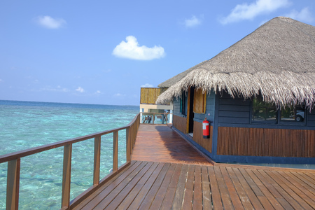 Beyond the bungalows the sea stretches on forever. Maldives Islands.のeditorial素材