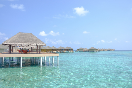 Beautiful dappled water surrounds the colony of water bungalows. Maldives Island.の写真素材