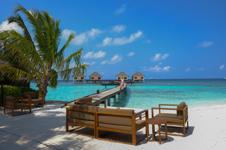 Enjoy the view of the gorgeous summer sea from the island colony's cool, relaxing resting area. Maldives Islands.の写真素材