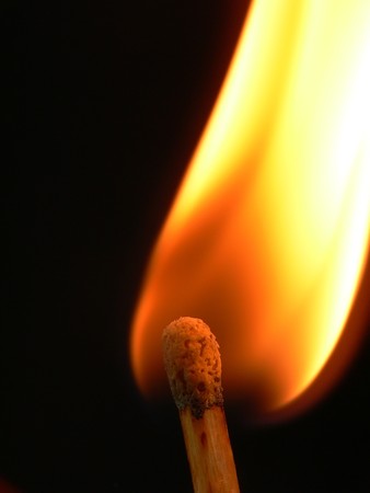 Close up picture of a match toked during burning