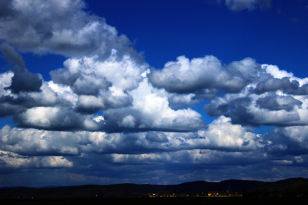 white fluffy clouds in the blue sky