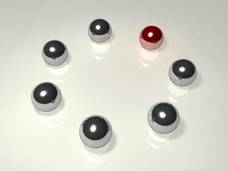Chrome balls are placed in a circle. One of them is red.の写真素材
