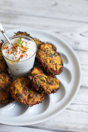 Pumpkin fritters with yoghurt sauceの写真素材