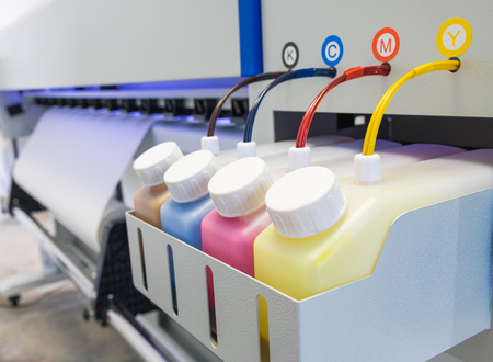Color ink tank or large printer machine in factory for printing business.