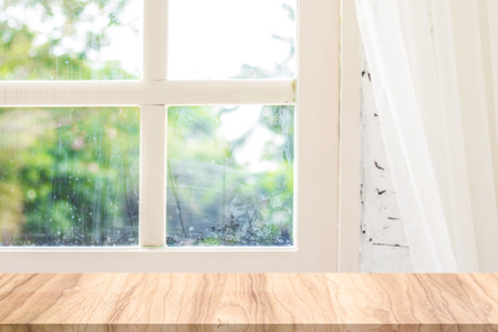 Empty wooden desk in the morning natural scene. Morning backdrops for your product.の写真素材