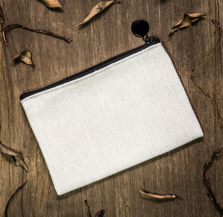 White textile bag on wooden background. Blank fabric bag for design.の写真素材