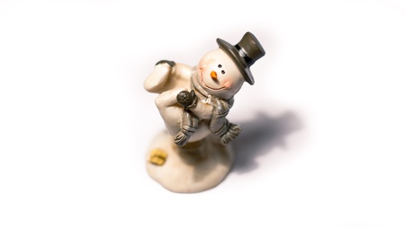 Happy snowman decoration on a white backgroundの写真素材