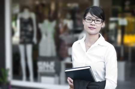 Beautiful Asian business woman in shopping mall の写真素材