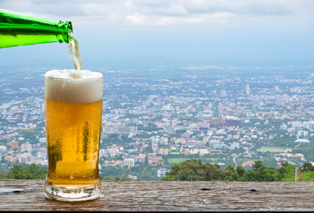 Enjoy beer with urban cityscape.の写真素材
