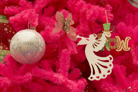 Pink Christmas tree with ornaments.の写真素材