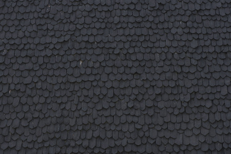 Ancient wooden roof tile on Northern Thai traditional home.