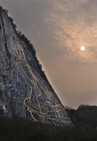 Big Buddha laser carved on mountain, Khao Chee Jan - Pattaya Chonburi, Thailand.の写真素材