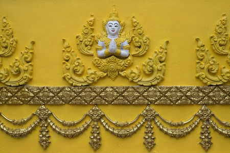 Angel on temple wall, Wat Si Muang Vientiane, Laos.の写真素材