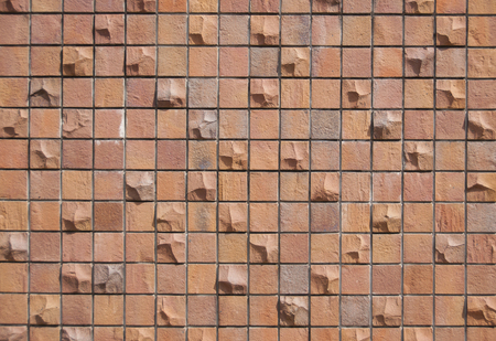 New red brick tile on concrete wall as background.