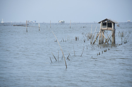 Seascape with fisherman hut in the sea in southern Thailand.の写真素材