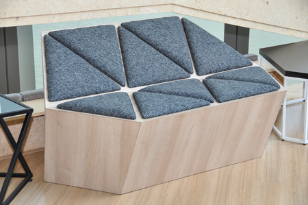 Modern wooden sofa with black triangle shape textile pad.の写真素材