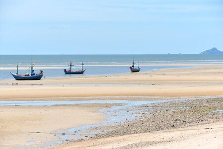 Old little fisherman boats on the beach in Thailand sea.の写真素材