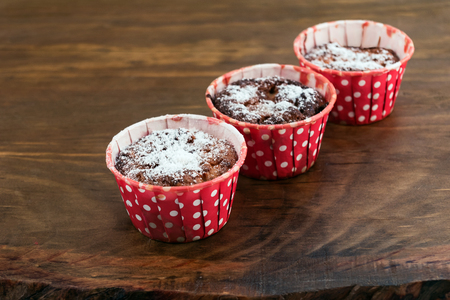 Bakeware red white polka dots with oatmeal cookies with a sprinkling of powdered sugar.の写真素材
