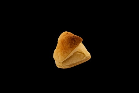 Heart shaped cookies. A gift for the day in love. Isolated on black background. Pastry made of dough.の写真素材