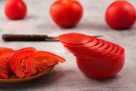 Non dull cooking. Decorative slicing of tomato. Cooking salad from raw vegetables.の写真素材