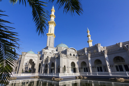 KUALA LUMPUR, MALAYSIA January 10, 2016: The Federal Territory mosque, Kuala Lumpur Malaysia at blue sky and reflection in waterのeditorial素材