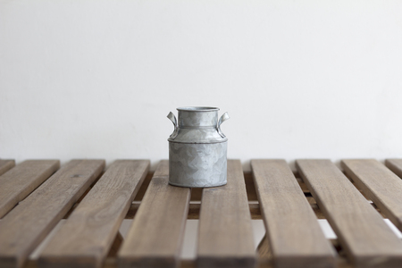 close up water containers for ornamental iron on the wooden tableの写真素材