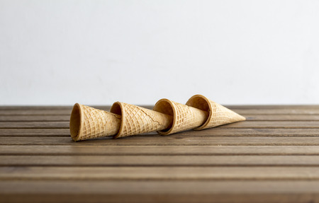 close up ice cream cones on the wooden tableの写真素材