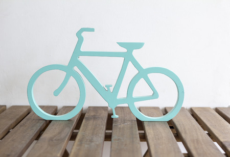 bicycle design with wood carvings on the wooden table
