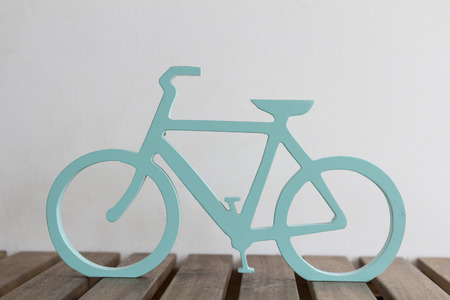 bicycle design with wood carvings on the wooden tableの写真素材