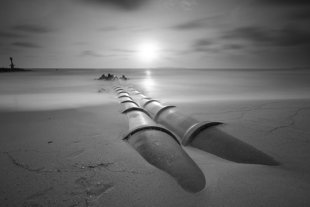 views on the waterfront with a turbulent sea of black and white version, long exposureの写真素材