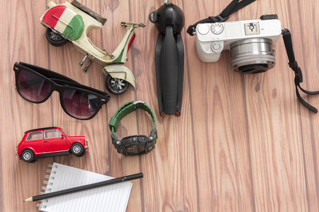 KUALA LUMPUR, MALAYSIA - JUNE 22, 2016 : Tripod, camera, toy, sanglass, watch, and note book. Travel Concept.のeditorial素材