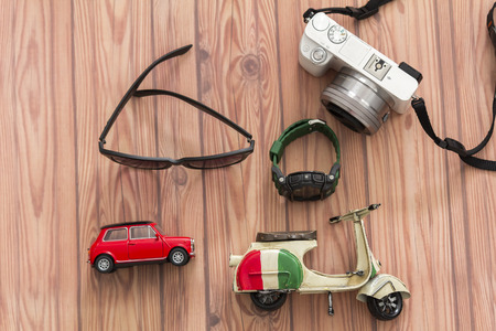 KUALA LUMPUR, MALAYSIA - JUNE 22, 2016 : Tripod, camera, toy, sanglass, and watch. Travel Concept.のeditorial素材