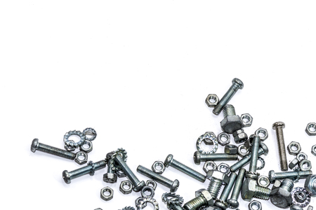 Chrome nuts and bolts closeup on plain backgroundの写真素材