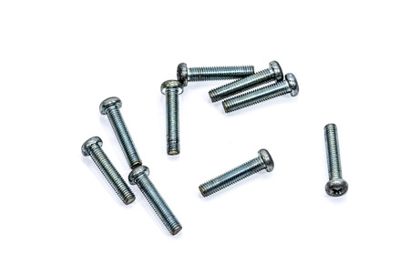 Chrome nuts and bolts closeup on plain backgroundの写真素材