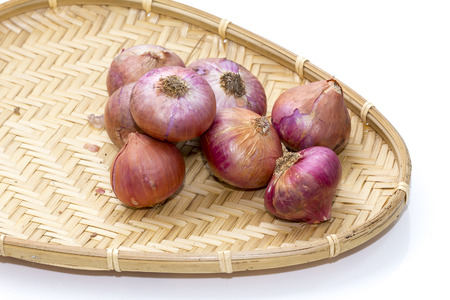onions in a wicker basketの写真素材