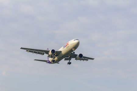 KUALA LUMPUR INTERNATIONAL AIRPORT (KLIA), SEPANG, MALAYSIA 14 May 2016: Airplane FedEx approaching airport at KLIA, Malaysia.のeditorial素材