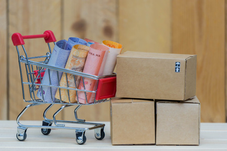 The boxes and the money in the trolley on the table