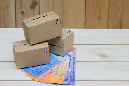 Boxes and money on the tableの写真素材