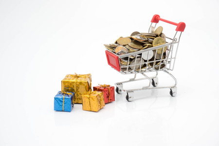shopping concept, trolley, coin and gift boxesの写真素材
