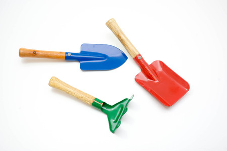 Gardening tools, spade, fork and rake  on white backgroundの写真素材